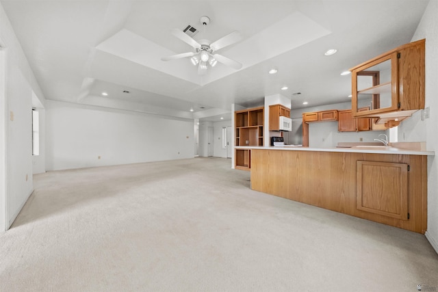 10266 S Del Rico, Yuma, AZ 85367 - kitchen with light colored carpet, a peninsula, recessed lighting, open floor plan, and a tray ceiling