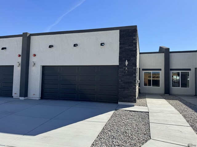 3751 E Santa Palmira St, San Luis, AZ 85336 - view of front of property with a garage, stucco siding, and driveway
