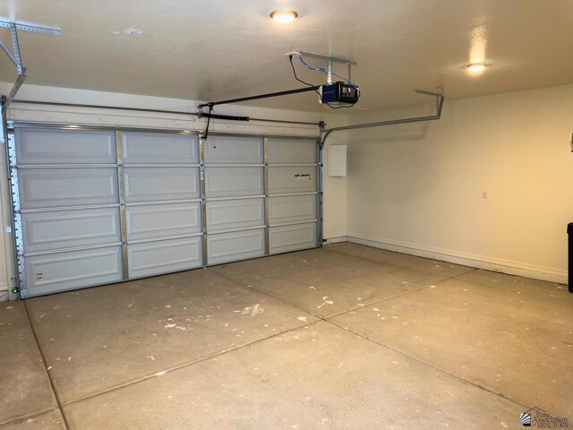 3751 E Santa Palmira St, San Luis, AZ 85336 - garage with baseboards and a garage door opener