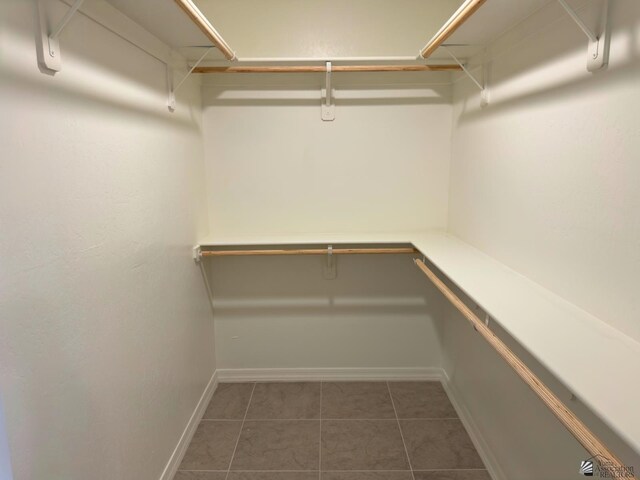 3751 E Santa Palmira St, San Luis, AZ 85336 - walk in closet featuring dark tile patterned flooring