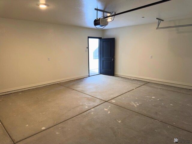 3751 E Santa Palmira St, San Luis, AZ 85336 - garage with baseboards and a garage door opener