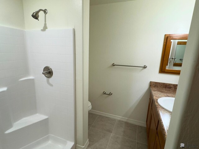 3751 E Santa Palmira St, San Luis, AZ 85336 - full bathroom with tile patterned flooring, a shower, vanity, baseboards, and toilet