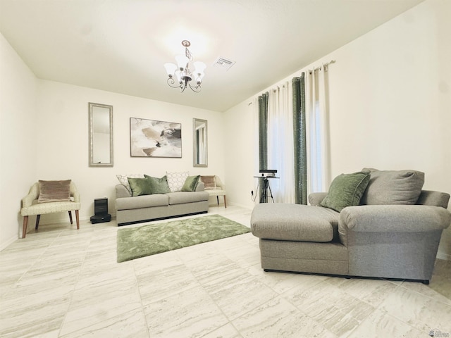 living room featuring baseboards, visible vents, and a notable chandelier