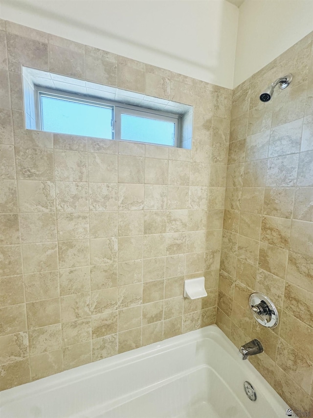 full bathroom with  shower combination and a healthy amount of sunlight