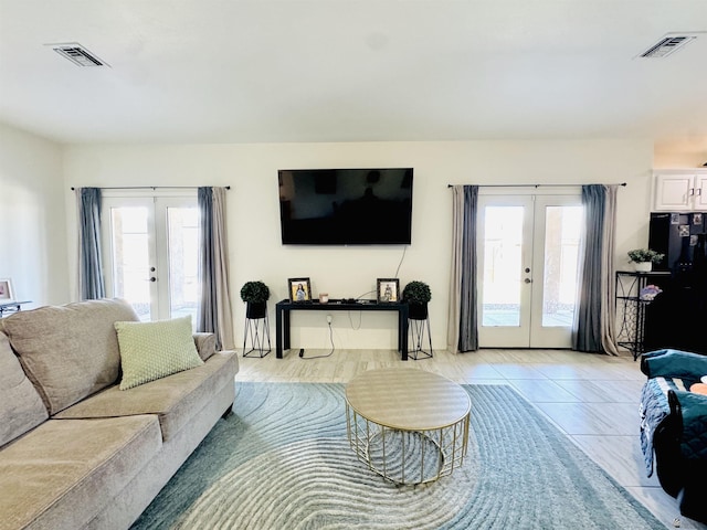 living area with french doors and visible vents