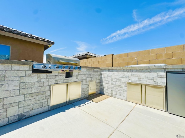 view of patio / terrace featuring fence and area for grilling