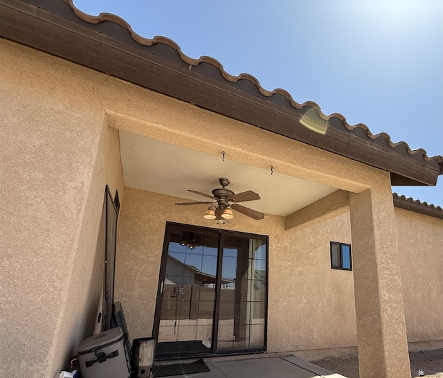 126 N Joe Harper Ct, San Luis, AZ 85349 - doorway to property featuring a ceiling fan and stucco siding