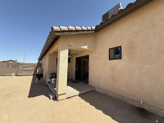 126 N Joe Harper Ct, San Luis, AZ 85349 - property entrance featuring a patio area, stucco siding, and ceiling fan