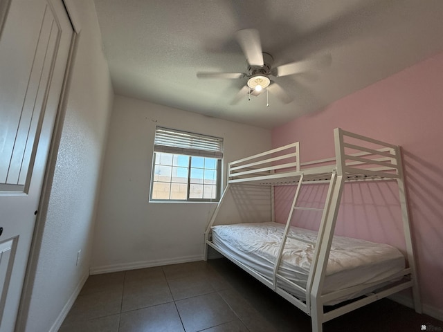126 N Joe Harper Ct, San Luis, AZ 85349 - tiled bedroom with baseboards and ceiling fan