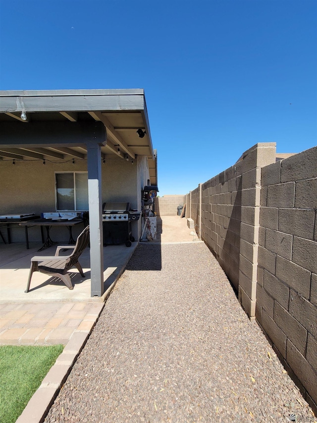 2193 S 40th Dr, Yuma, AZ 85364 - fenced backyard with a patio area