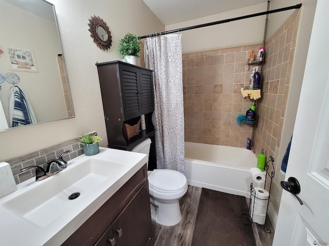 2193 S 40th Dr, Yuma, AZ 85364 - bathroom featuring vanity, wood finished floors, shower / bath combination with curtain, and backsplash