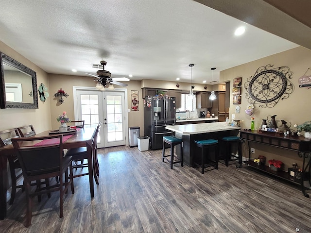 2193 S 40th Dr, Yuma, AZ 85364 - dining area with dark wood-style flooring, ceiling fan, french doors, recessed lighting, and a textured ceiling