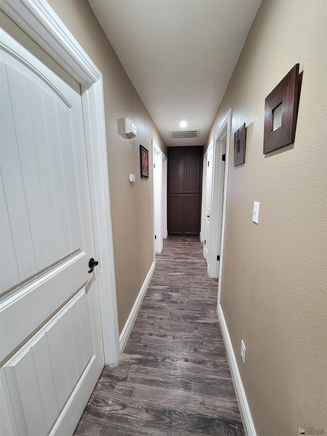 2193 S 40th Dr, Yuma, AZ 85364 - corridor with dark wood-style floors and a textured wall