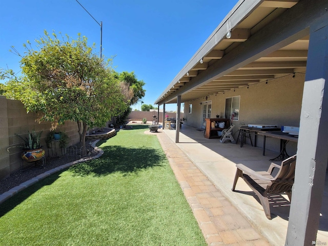 2193 S 40th Dr, Yuma, AZ 85364 - fenced backyard with a patio area