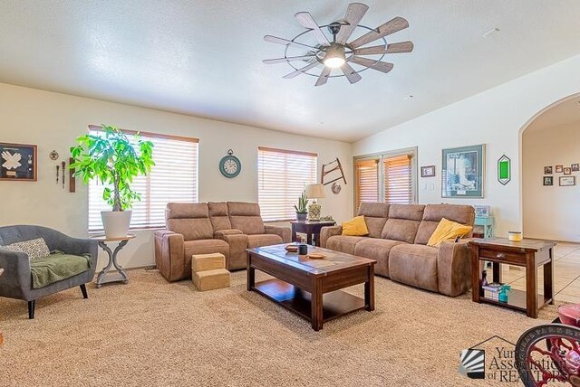 6324 E 45th Ln, Yuma, AZ 85365 - living room featuring a ceiling fan, arched walkways, light carpet, and lofted ceiling