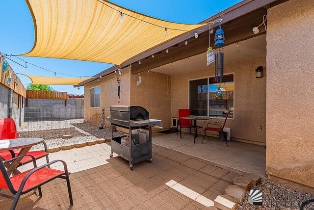 6324 E 45th Ln, Yuma, AZ 85365 - fenced backyard featuring a patio and outdoor dining space