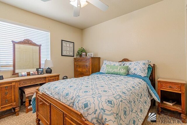 6324 E 45th Ln, Yuma, AZ 85365 - bedroom featuring light carpet and a ceiling fan