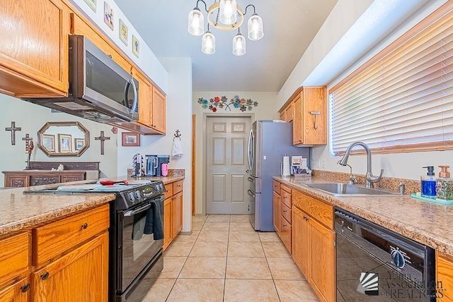6324 E 45th Ln, Yuma, AZ 85365 - kitchen featuring black appliances, light tile patterned flooring, light countertops, and a chandelier
