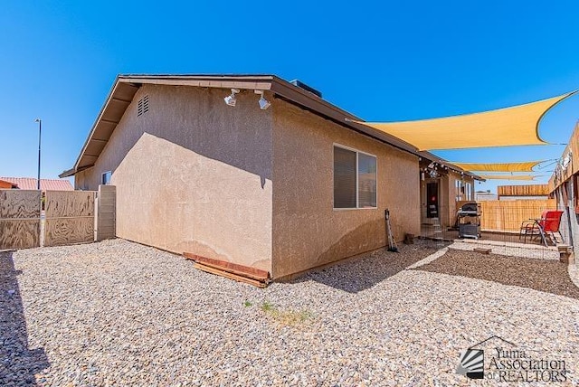 6324 E 45th Ln, Yuma, AZ 85365 - view of home's exterior with a patio area, stucco siding, and a fenced backyard