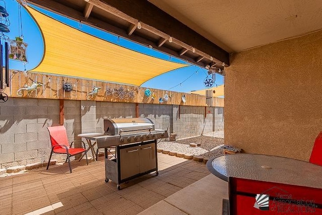 6324 E 45th Ln, Yuma, AZ 85365 - fenced backyard with a patio and a grill