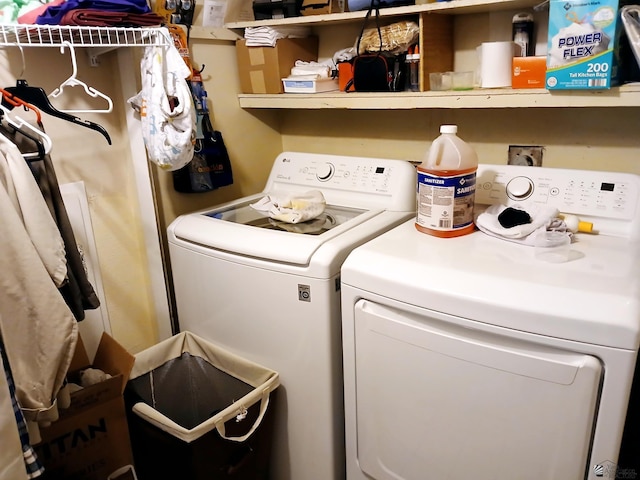 clothes washing area with laundry area and washing machine and dryer