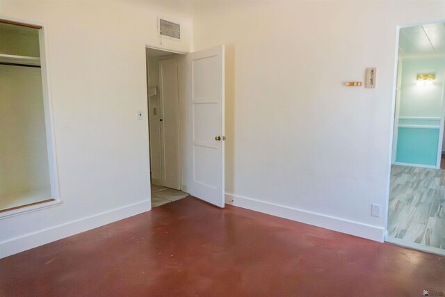 577 S 8th Ave, Yuma, AZ 85364 - unfurnished bedroom with a closet and concrete flooring