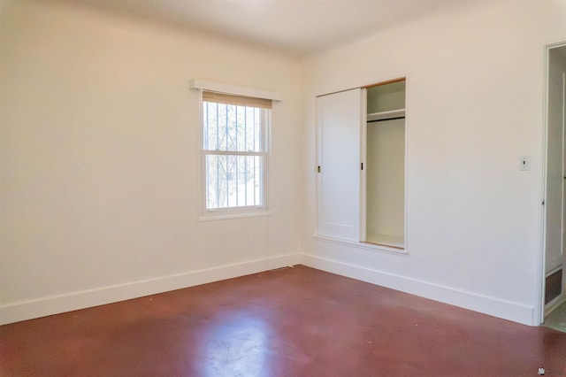 577 S 8th Ave, Yuma, AZ 85364 - unfurnished bedroom featuring finished concrete flooring and a closet
