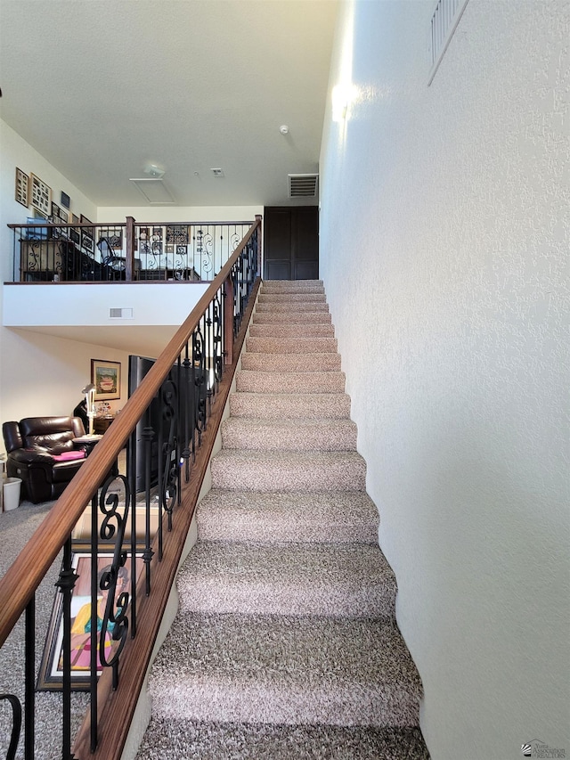 7270 E 38th Ln, Yuma, AZ 85365 - staircase with carpet and a textured wall