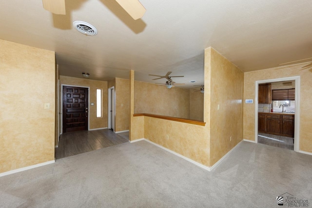 interior space featuring carpet floors and sink