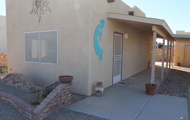 back of house with a patio