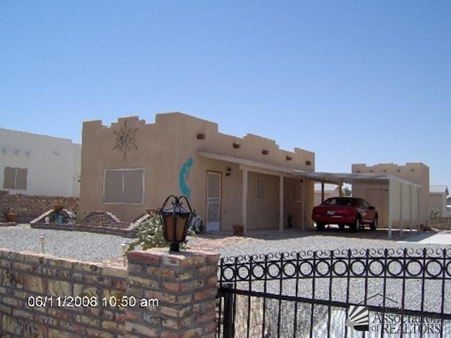 rear view of property with a carport