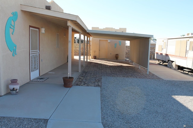 view of patio with a carport