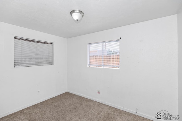 1344 W 13th St, Yuma, AZ 85364 - spare room with carpet flooring and baseboards