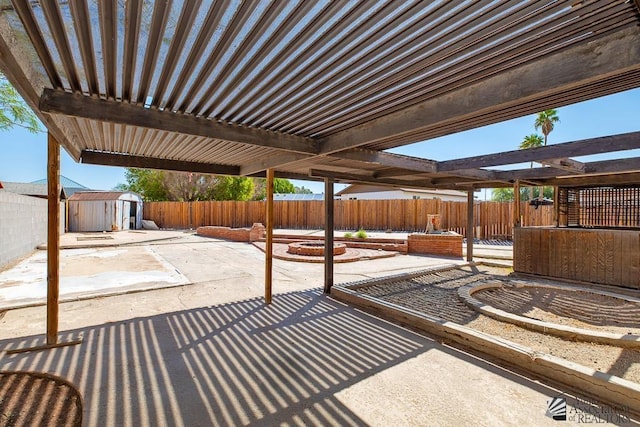1344 W 13th St, Yuma, AZ 85364 - fenced backyard featuring a patio and a fire pit