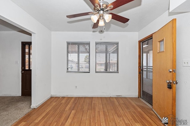 1344 W 13th St, Yuma, AZ 85364 - unfurnished room with plenty of natural light, light wood finished floors, a ceiling fan, and baseboards
