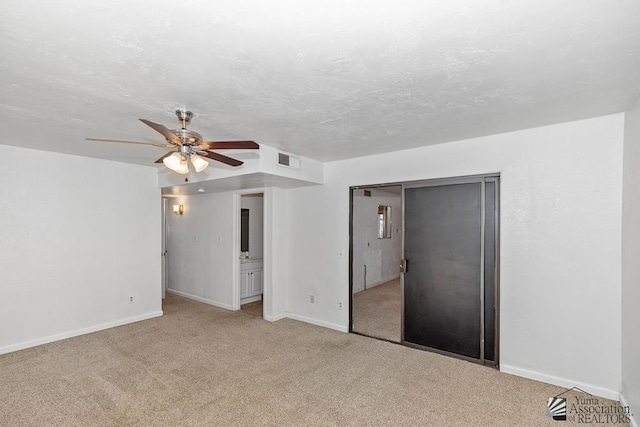 1344 W 13th St, Yuma, AZ 85364 - unfurnished bedroom with carpet flooring, baseboards, a ceiling fan, and a closet