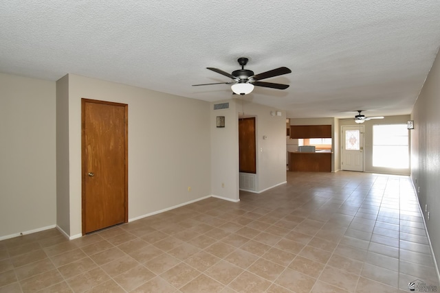 tiled empty room with ceiling fan