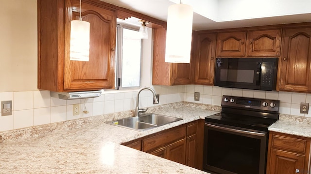 kitchen with a sink, stainless steel range with electric stovetop, brown cabinets, and black microwave