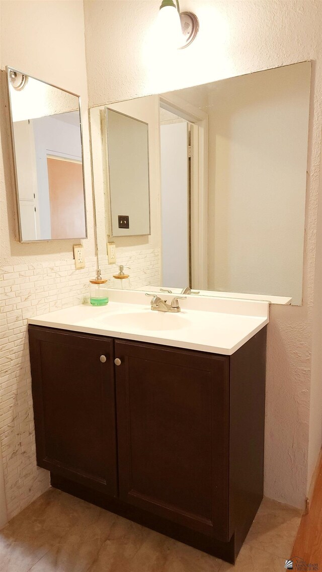 1830 S Athens Ave, Yuma, AZ 85364 - bathroom featuring vanity and a textured wall