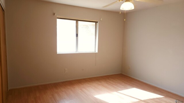 1830 S Athens Ave, Yuma, AZ 85364 - unfurnished room with baseboards, a ceiling fan, and light wood-style flooring