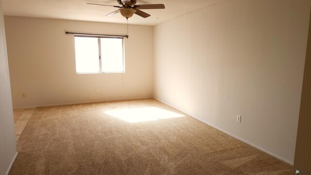 1830 S Athens Ave, Yuma, AZ 85364 - spare room featuring baseboards, a ceiling fan, and light colored carpet
