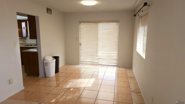 1830 S Athens Ave, Yuma, AZ 85364 - unfurnished room featuring light tile patterned floors, baseboards, and visible vents