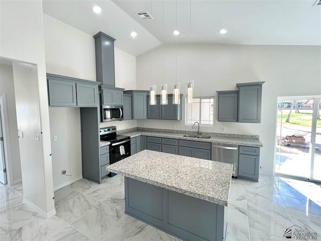 kitchen with pendant lighting, a center island, high vaulted ceiling, sink, and stainless steel appliances