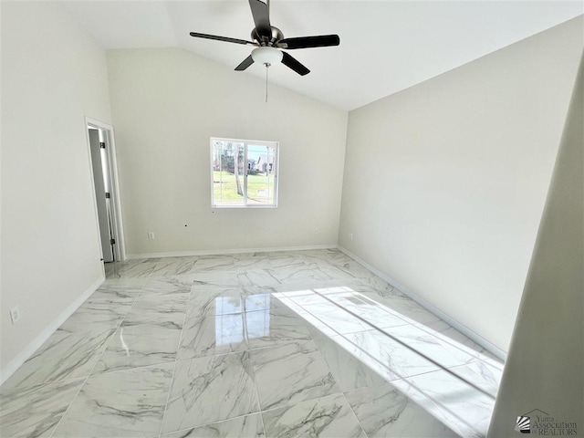 empty room featuring ceiling fan and lofted ceiling