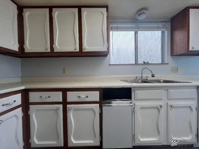 kitchen with sink and white cabinets