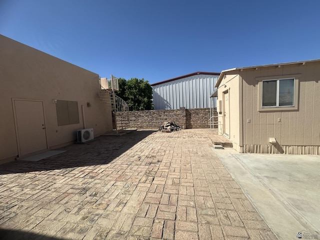 view of patio / terrace featuring a fenced backyard and ac unit