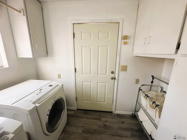 laundry room with separate washer and dryer, cabinet space, dark wood-style flooring, and baseboards