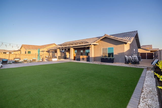 5712 E 45th Pl, Yuma, AZ 85365 - back of house with a patio area, stucco siding, and a tiled roof