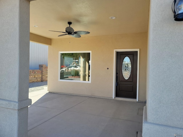 13129 E 47th Ln, Yuma, AZ 85367 - property entrance with a ceiling fan, a patio, and stucco siding