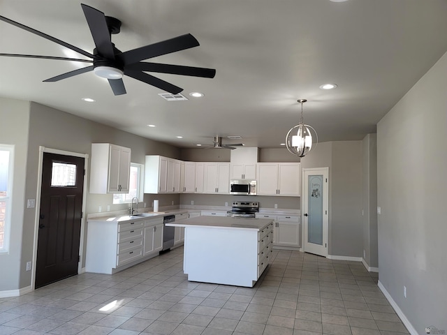 13129 E 47th Ln, Yuma, AZ 85367 - kitchen with ceiling fan, appliances with stainless steel finishes, light countertops, baseboards, and light tile patterned flooring
